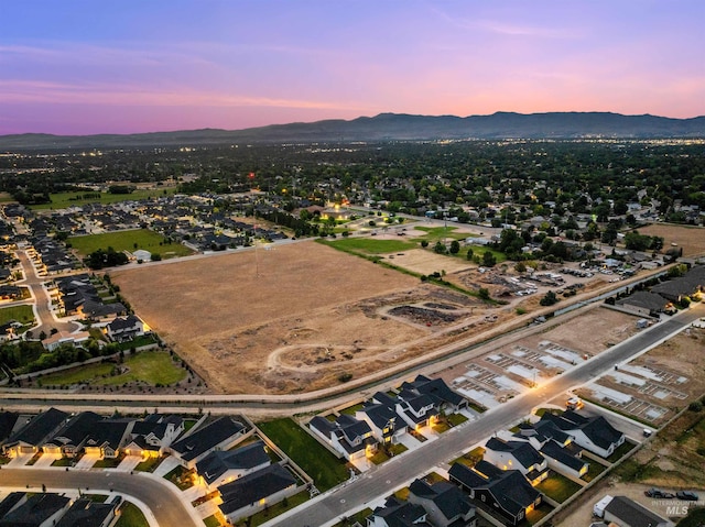 aerial view at dusk with a mountain view