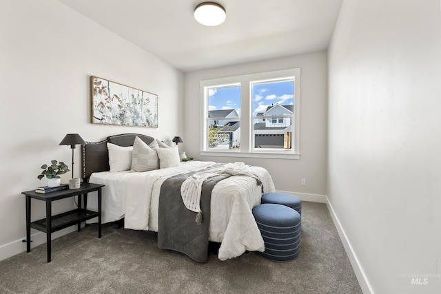 carpeted bedroom with baseboards