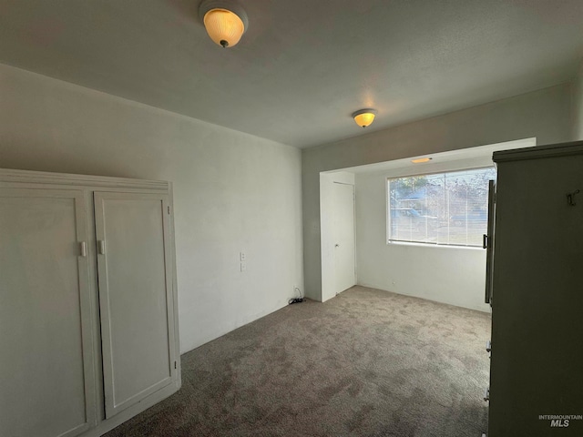 spare room featuring carpet flooring