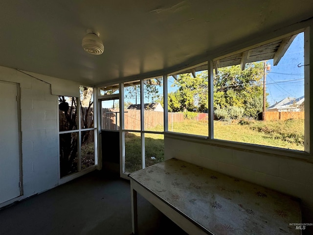 unfurnished sunroom featuring a healthy amount of sunlight