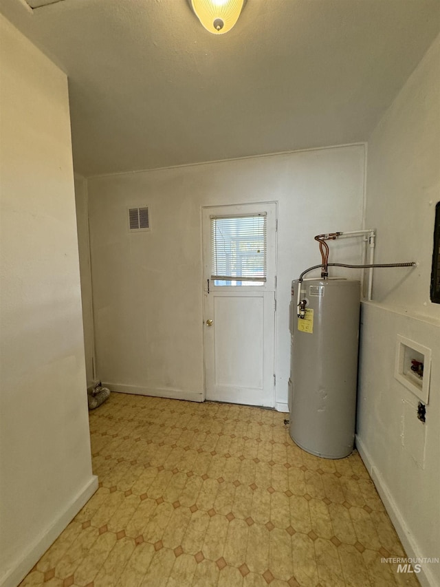 660 SW 2nd St, Ontario, OR 97914 - utility room featuring electric water heater