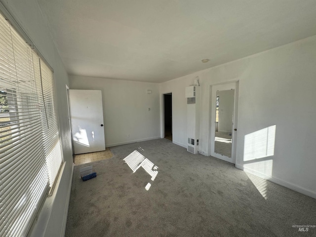 660 SW 2nd St, Ontario, OR 97914 - unfurnished bedroom with multiple windows, carpet flooring, and baseboards