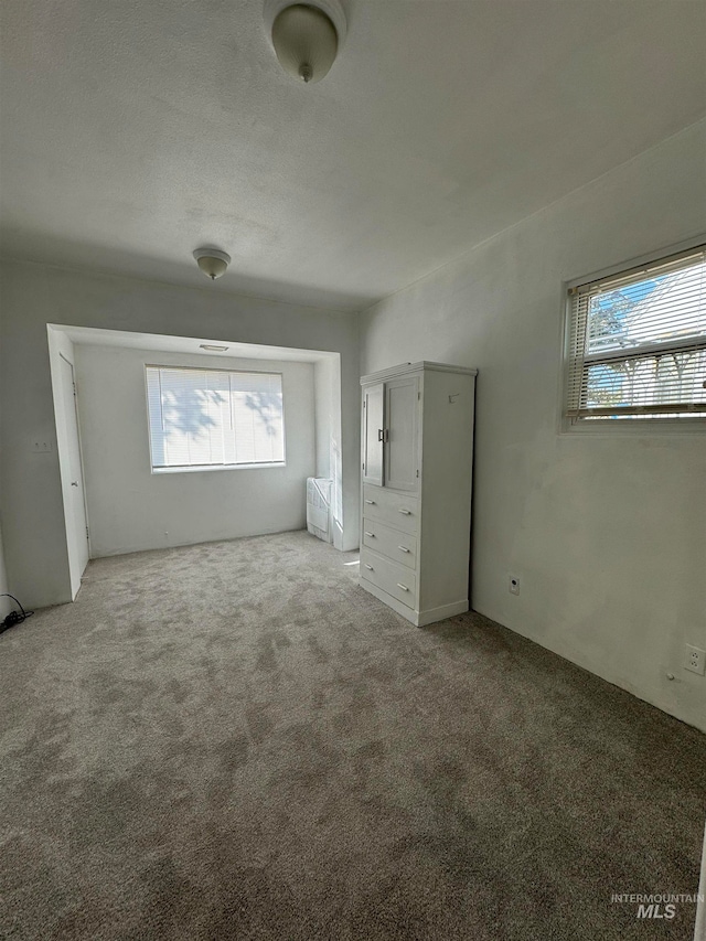 unfurnished bedroom with carpet floors