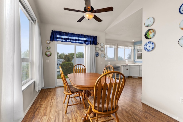 2313 River Oaks Ct, Nampa, ID 83686 - dining area featuring lofted ceiling, plenty of natural light, a ceiling fan, light wood-style floors, and baseboards