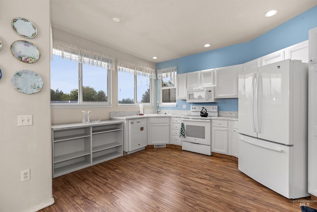 2313 River Oaks Ct, Nampa, ID 83686 - kitchen featuring white appliances, a sink, dark wood-type flooring, white cabinetry, and recessed lighting
