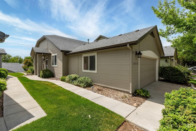 2313 River Oaks Ct, Nampa, ID 83686 - view of home's exterior featuring roof with shingles and a lawn