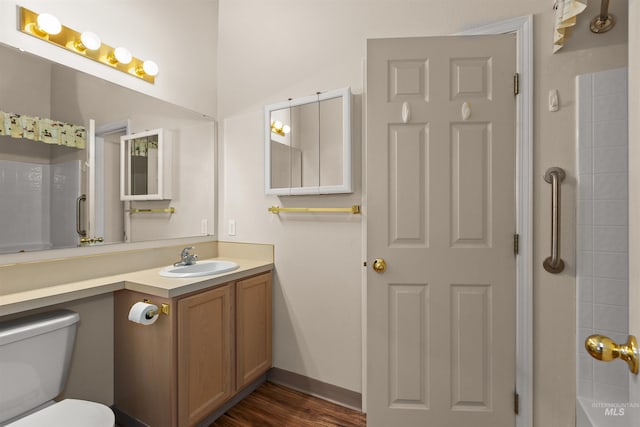 2313 River Oaks Ct, Nampa, ID 83686 - bathroom with vanity, toilet, wood finished floors, and shower / bath combination
