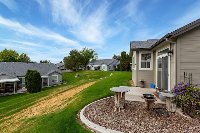 2313 River Oaks Ct, Nampa, ID 83686 - view of green lawn with a patio and a residential view