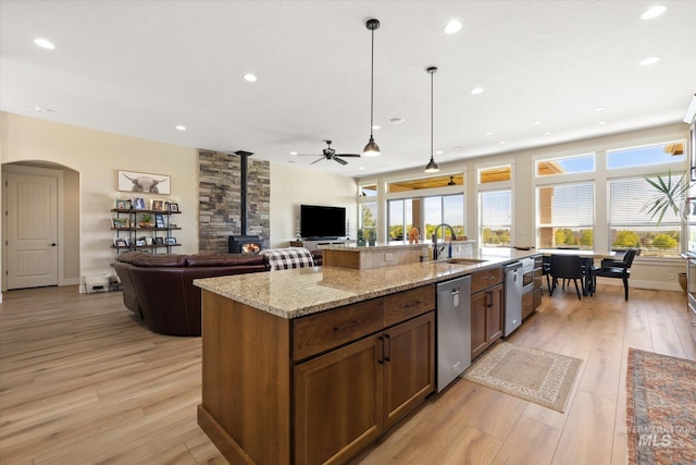 550 W Heikes Ln, Eagle, ID 83616 - kitchen featuring dishwasher, a wood stove, light wood-type flooring, ceiling fan, and recessed lighting