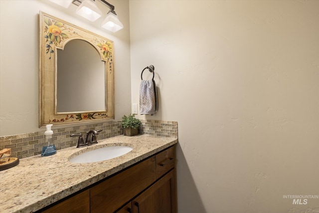 550 W Heikes Ln, Eagle, ID 83616 - bathroom featuring decorative backsplash and vanity