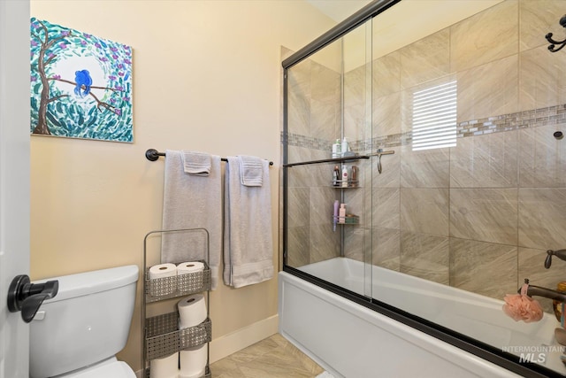 550 W Heikes Ln, Eagle, ID 83616 - full bathroom featuring shower / bath combination with glass door, toilet, baseboards, and marble finish floors