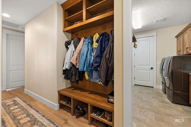 550 W Heikes Ln, Eagle, ID 83616 - mudroom with baseboards and washer and dryer