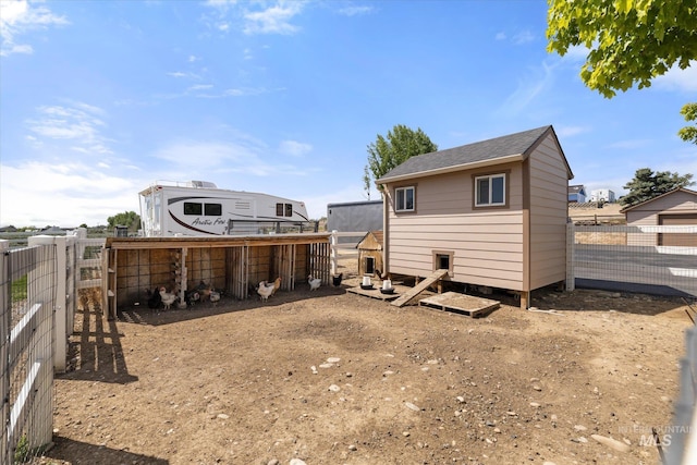550 W Heikes Ln, Eagle, ID 83616 - back of property featuring exterior structure and an outdoor structure