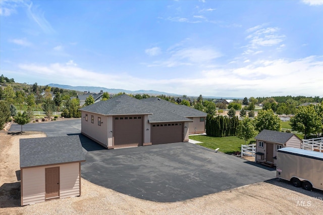 550 W Heikes Ln, Eagle, ID 83616 - garage with a storage unit and a mountain view