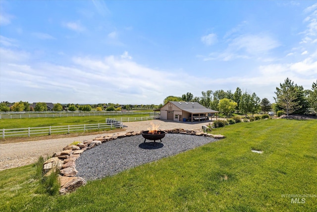 550 W Heikes Ln, Eagle, ID 83616 - view of yard featuring a fire pit, a patio, and a view of countryside