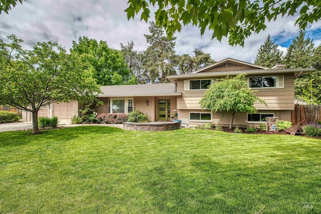6174 W Winstead Pl, Boise, ID 83704 - tri-level home with a garage and driveway