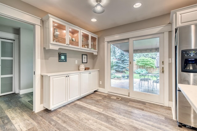 6174 W Winstead Pl, Boise, ID 83704 - bar area featuring stainless steel refrigerator with ice dispenser, light wood-type flooring, baseboards, and recessed lighting