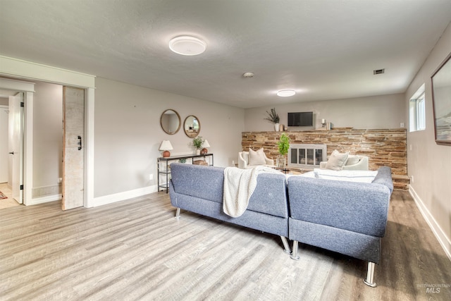 6174 W Winstead Pl, Boise, ID 83704 - living area featuring wood finished floors, baseboards, and a fireplace