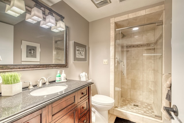 6174 W Winstead Pl, Boise, ID 83704 - bathroom with a shower stall, toilet, vanity, and tile patterned flooring