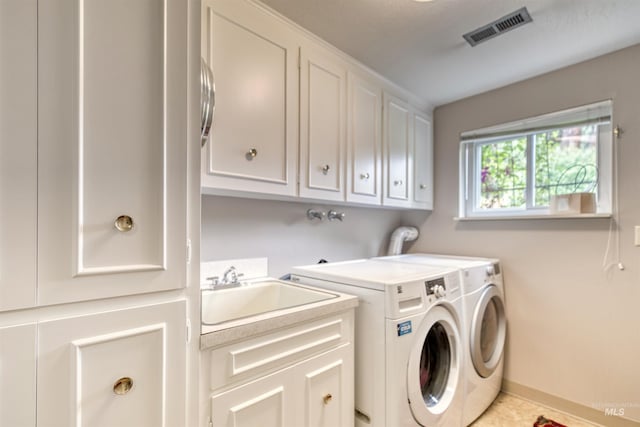 6174 W Winstead Pl, Boise, ID 83704 - clothes washing area with cabinet space, independent washer and dryer, and baseboards