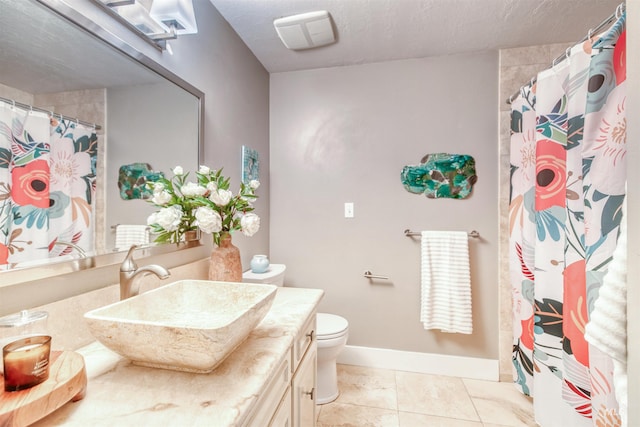 6174 W Winstead Pl, Boise, ID 83704 - bathroom featuring vanity, tile patterned flooring, baseboards, toilet, and curtained shower