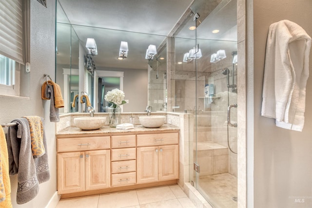 6174 W Winstead Pl, Boise, ID 83704 - full bathroom with tile patterned flooring, a stall shower, double vanity, and decorative backsplash