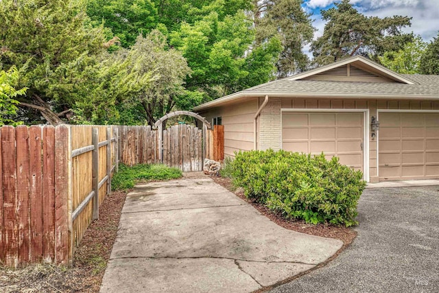6174 W Winstead Pl, Boise, ID 83704 - view of side of property featuring roof with shingles, fence, and brick siding