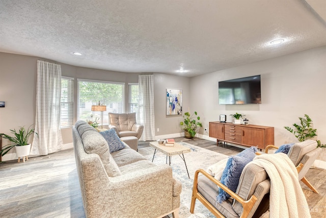 6174 W Winstead Pl, Boise, ID 83704 - living area with a textured ceiling, baseboards, wood finished floors, and recessed lighting
