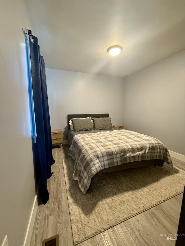 bedroom featuring hardwood / wood-style flooring