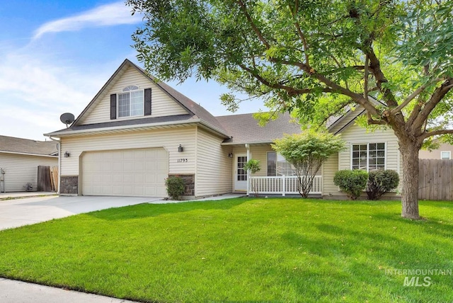 11793 Shelburne, Caldwell, ID 83605 - view of front of house featuring a porch, fence, a front lawn, concrete driveway, and an attached garage