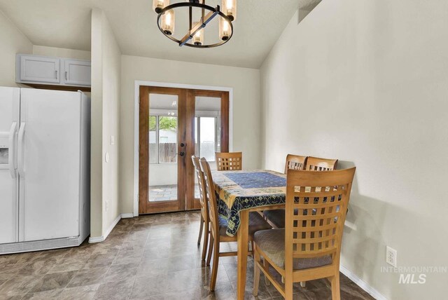 11793 Shelburne, Caldwell, ID 83605 - dining space with french doors, a chandelier, and baseboards