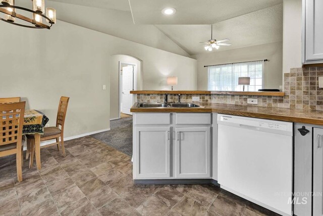 11793 Shelburne, Caldwell, ID 83605 - kitchen featuring a sink, white dishwasher, vaulted ceiling, a peninsula, and ceiling fan with notable chandelier