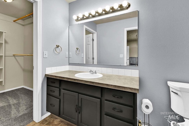 11793 Shelburne, Caldwell, ID 83605 - bathroom featuring toilet, a walk in closet, and vanity