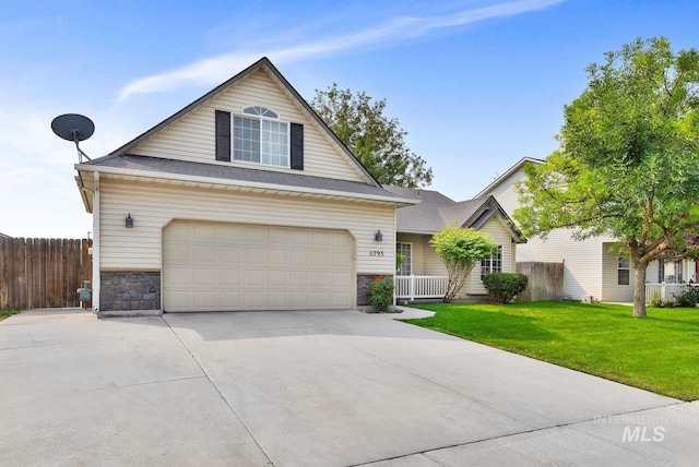 11793 Shelburne, Caldwell, ID 83605 - traditional home with fence, concrete driveway, a front lawn, and stone siding