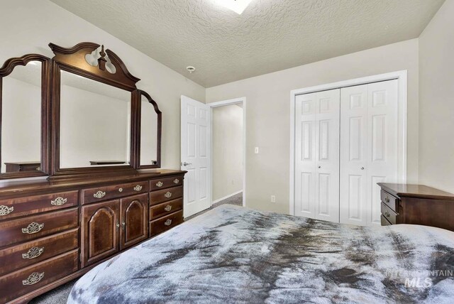 11793 Shelburne, Caldwell, ID 83605 - carpeted bedroom with a textured ceiling and a closet