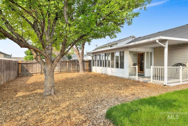 11793 Shelburne, Caldwell, ID 83605 - view of yard with a sunroom and a fenced backyard
