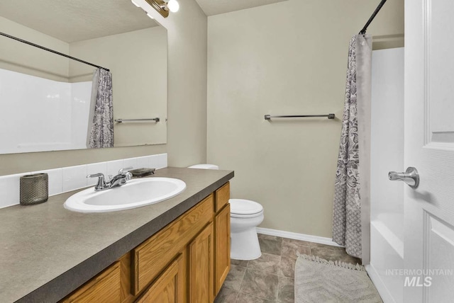 11793 Shelburne, Caldwell, ID 83605 - bathroom with baseboards, a shower with shower curtain, toilet, and vanity