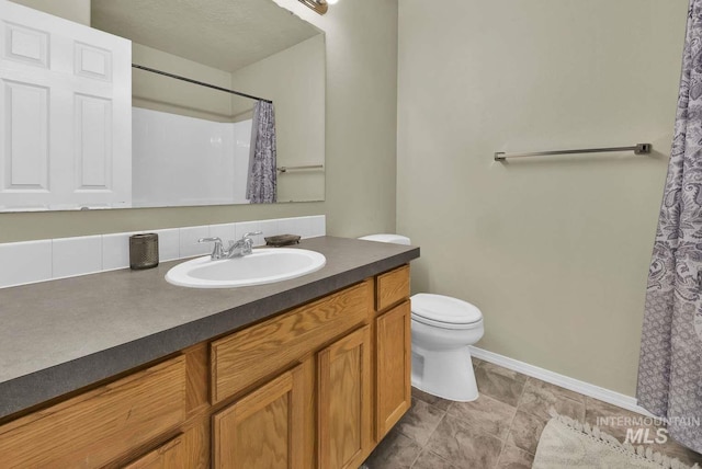 11793 Shelburne, Caldwell, ID 83605 - full bath with baseboards, curtained shower, toilet, and vanity