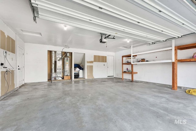 11793 Shelburne, Caldwell, ID 83605 - garage featuring a garage door opener and water heater