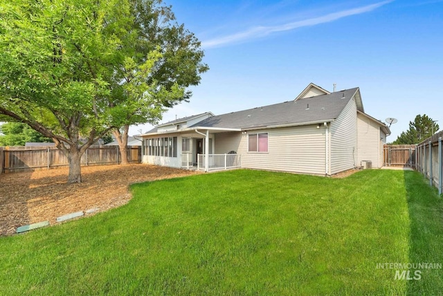 11793 Shelburne, Caldwell, ID 83605 - rear view of property with a fenced backyard and a lawn