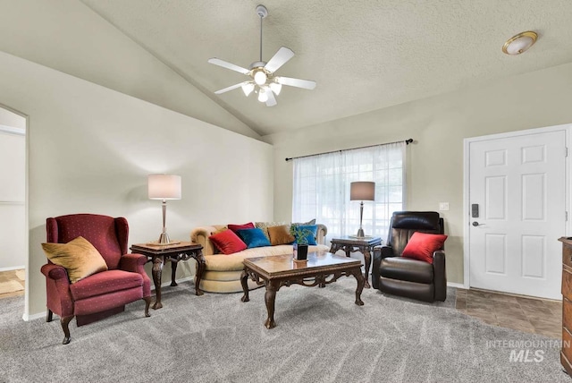 11793 Shelburne, Caldwell, ID 83605 - carpeted living area featuring lofted ceiling, a textured ceiling, a ceiling fan, and baseboards