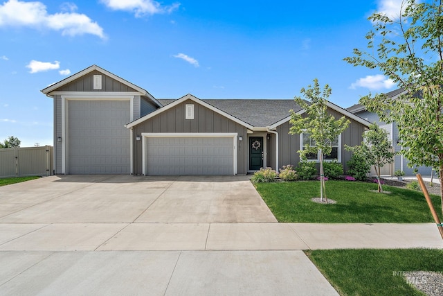 2701 N Ice Fire Pl, Star, ID 83669 - ranch-style home featuring an attached garage, concrete driveway, a front lawn, a gate, and board and batten siding