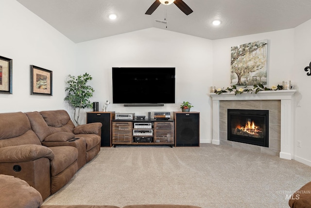 2701 N Ice Fire Pl, Star, ID 83669 - carpeted living area with ceiling fan, a tiled fireplace, lofted ceiling, recessed lighting, and baseboards