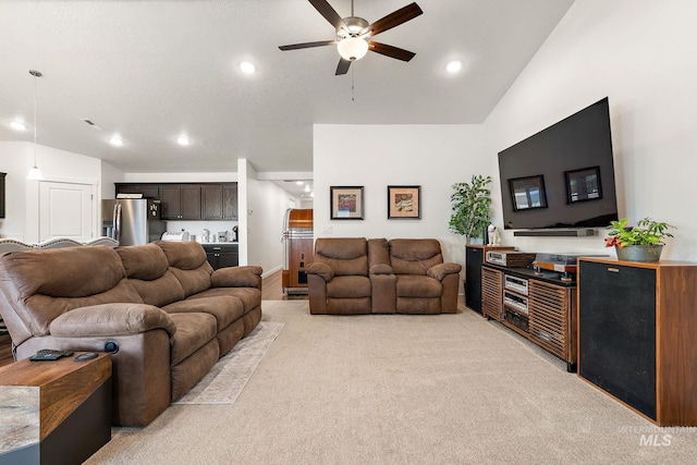 2701 N Ice Fire Pl, Star, ID 83669 - living room featuring vaulted ceiling, ceiling fan, light colored carpet, and recessed lighting