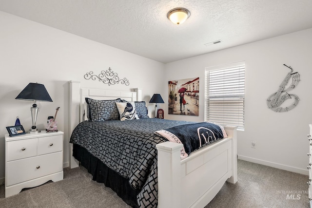 2701 N Ice Fire Pl, Star, ID 83669 - bedroom featuring a textured ceiling, carpet floors, and baseboards