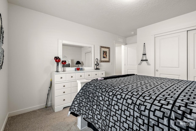 2701 N Ice Fire Pl, Star, ID 83669 - bedroom with baseboards, light carpet, a closet, and a textured ceiling