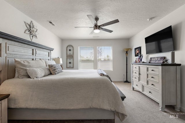 2701 N Ice Fire Pl, Star, ID 83669 - bedroom featuring light colored carpet, ceiling fan, a textured ceiling, and baseboards