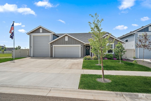 2701 N Ice Fire Pl, Star, ID 83669 - view of front of house with an attached garage, board and batten siding, concrete driveway, and a shingled roof