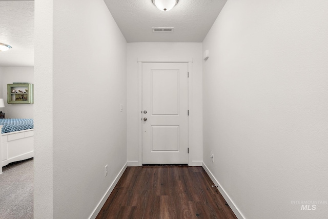 2701 N Ice Fire Pl, Star, ID 83669 - corridor featuring dark wood-style flooring and baseboards