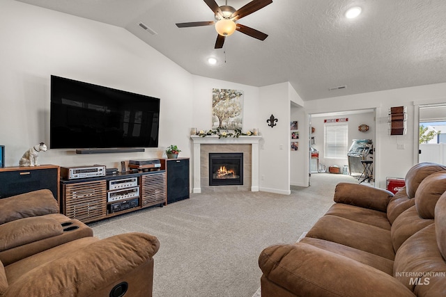 2701 N Ice Fire Pl, Star, ID 83669 - living room with ceiling fan, carpet flooring, vaulted ceiling, a fireplace, and baseboards